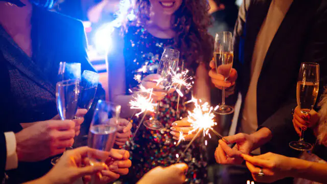 Celebrating at The Clarendon with sparklers and champagne, ideal for festive events and vibrant London stays.